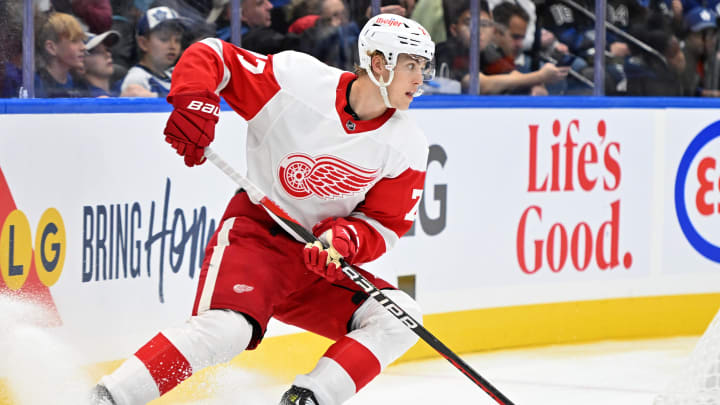 Oct 5, 2023; Toronto, Ontario, CAN; Detroit Red Wings defenseman Simon Edvinsson (77) skates with the puck against the Toronto Maple Leafs in the third period at Scotiabank Arena. Mandatory Credit: Dan Hamilton-USA TODAY Sports