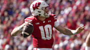 Sep 7, 2024; Madison, Wisconsin, USA;  Wisconsin Badgers quarterback Tyler Van Dyke (10) throws a pass during the first quarter against the South Dakota Coyotes at Camp Randall Stadium. Mandatory Credit: Jeff Hanisch-Imagn Images