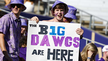 Sep 21, 2024; Seattle, Washington, USA; A Washington Huskiies fan holds a sign before the team’s first Big Ten conference game against the Northwestern Wildcats at Alaska Airlines Field at Husky Stadium. Mandatory Credit: Joe Nicholson-Imagn Images