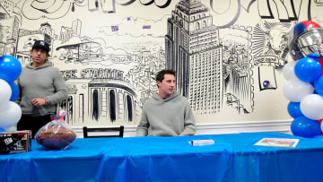 Tommy DeVito is shown seated at Bogie's Hoagies, near his agent, Sean Stellato.  