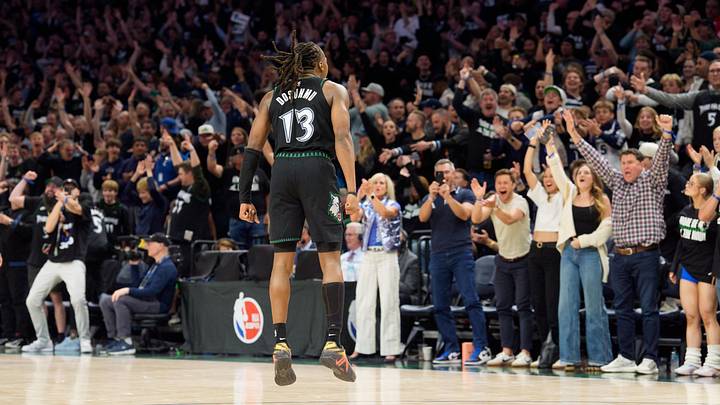 Apr 25, 2026; Minneapolis, Minnesota, USA; Minnesota Timberwolves guard Ayo Dosunmu (13) celebrates with fans after making a three-point shot against the Denver Nuggets in the fourth quarter at Target Center. Mandatory Credit: Matt Blewett-Imagn Images