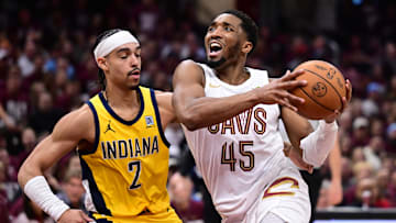 May 4, 2025; Cleveland, Ohio, USA; Cleveland Cavaliers guard Donovan Mitchell (45) drives to the basket against Indiana Pacers guard Andrew Nembhard (2) during the second half in game one of the second round for the 2025 NBA Playoffs at Rocket Arena. Mandatory Credit: Ken Blaze-Imagn Images