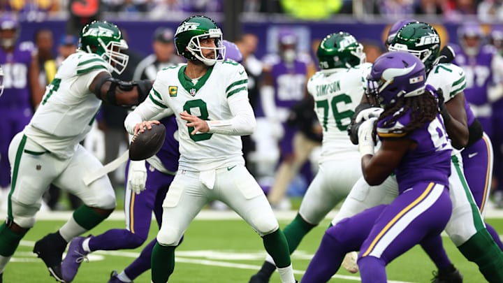 Minnesota New York Jets Quarterback Aaron Rodgers hands the ball over to in the 1st Quarter against Minnesota Vikings