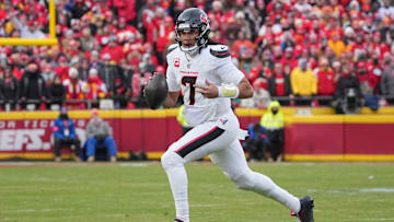 Jan 18, 2025; Kansas City, Missouri, USA; Houston Texans quarterback C.J. Stroud (7) scrambles in the backfield against the Kansas City Chiefs during the first half of a 2025 AFC divisional round game at GEHA Field at Arrowhead Stadium. Mandatory Credit: Denny Medley-Imagn Images