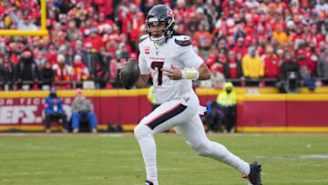 Jan 18, 2025; Kansas City, Missouri, USA; Houston Texans quarterback C.J. Stroud (7) scrambles in the backfield against the Kansas City Chiefs during the first half of a 2025 AFC divisional round game at GEHA Field at Arrowhead Stadium. Mandatory Credit: Denny Medley-Imagn Images