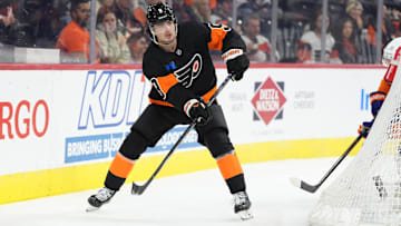 Apr 12, 2025; Philadelphia, Pennsylvania, USA; Philadelphia Flyers defenseman Jamie Drysdale (9) passes the puck against the New York Islanders in the first period at Wells Fargo Center.