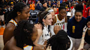 Jun 30, 2024; Phoenix, Arizona, USA; Indiana Fever guard Caitlin Clark (22) in the huddle with teammates against the Phoenix Mercury during a WNBA game at Footprint Center. Mandatory Credit: Mark J. Rebilas-Imagn Images