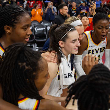 Jun 30, 2024; Phoenix, Arizona, USA; Indiana Fever guard Caitlin Clark (22) in the huddle with teammates against the Phoenix Mercury during a WNBA game at Footprint Center. Mandatory Credit: Mark J. Rebilas-Imagn Images