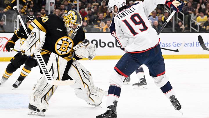 Feb 26, 2026; Boston, Massachusetts, USA; Boston Bruins goaltender Michael DiPietro (80) makes a save against Columbus Blue Jackets center Adam Fantilli (19) during the second period at TD Garden. Mandatory Credit: Eric Canha-Imagn Images