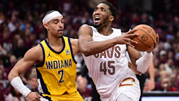 May 4, 2025; Cleveland, Ohio, USA; Cleveland Cavaliers guard Donovan Mitchell (45) drives to the basket against Indiana Pacers guard Andrew Nembhard (2) during the second half in game one of the second round for the 2025 NBA Playoffs at Rocket Arena. Mandatory Credit: Ken Blaze-Imagn Images