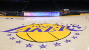 Apr 9, 2024; Los Angeles, California, USA; THe Los Angeles Lakers logo at midcourt Crypto.com Arena.
