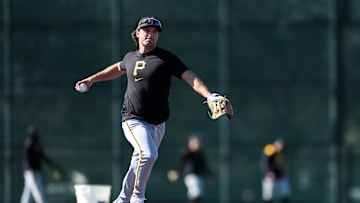 Feb 17, 2025; Bradenton, FL, USA;  Pittsburgh Pirates infielder Adam Frazier (26) participates in spring training workouts at Pirate City. Mandatory Credit: Nathan Ray Seebeck-Imagn Images