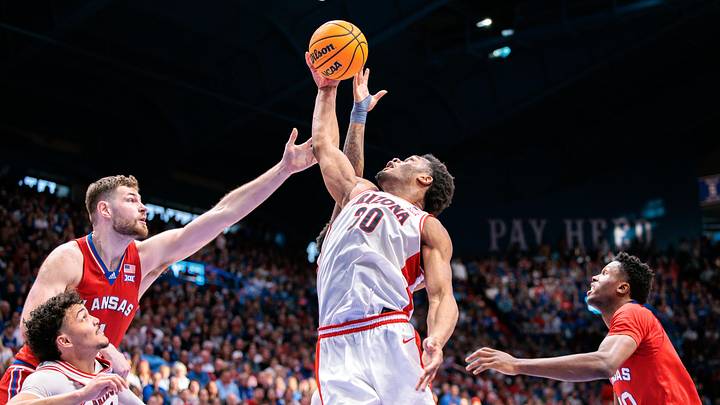 Mar 8, 2025; Lawrence, Kansas, USA; Arizona Wildcats forward Tobe Awaka (30) rebounds during the second half against the Kansas Jayhawks at Allen Fieldhouse. Mandatory Credit: William Purnell-Imagn Images