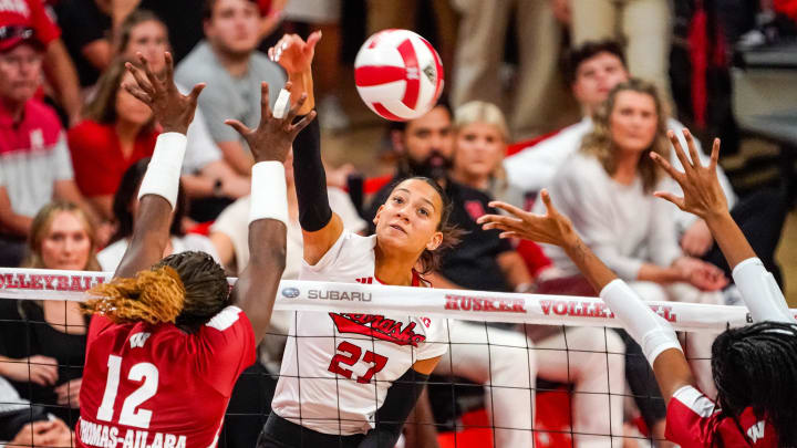 Oct 21, 2023; Lincoln, NE, USA; Nebraska Cornhuskers outside hitter Harper Murray (27) attacks against Wisconsin Badgers outside hitter Temi Thomas-Ailara (12) during the fourth set at the Bob Devaney Sports Center. TODAY Sports