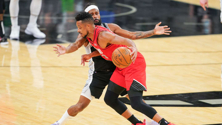 Apr 16, 2021; San Antonio, Texas, USA; Portland Trail Blazers guard CJ McCollum (3) dribbles into San Antonio Spurs guard Patty Mills (8) in the first half at the AT&T Center. Mandatory Credit: Daniel Dunn-USA TODAY Sports