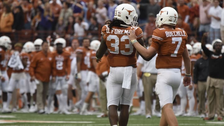 Nov 25, 2016; Austin, TX, USA; Texas Longhorns quarterback Shane Buechele (7) and running back D'Onta Foreman (33) react against the Texas Christian Horned Frogs during the first half at Darrell K Royal-Texas Stadium. TCU won 31-9. Mandatory Credit: Brendan Maloney-USA TODAY Sports