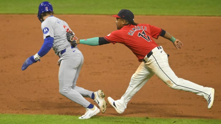 Aug 13, 2024; Cleveland, Ohio, USA; Chicago Cubs second baseman Nico Hoerner (2) is tagged out by Cleveland Guardians third baseman Jose Ramirez (11) to end the game in the ninth inning at Progressive Field. Mandatory Credit: David Richard-USA TODAY Sports