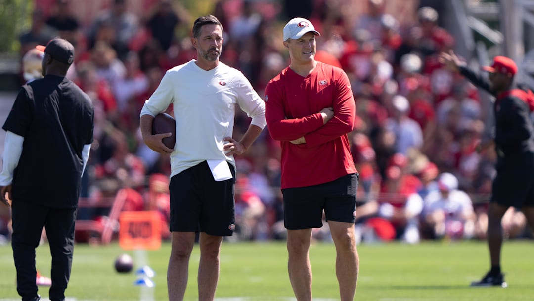 Jul 27, 2022; Santa Clara, CA, USA; San Francisco 49ers head coach Kyle Shanahan (left) and general manager John Lynch watches the players during Training Camp at the SAP Performance Facility near Levi Stadium. Mandatory Credit: Stan Szeto-Imagn Images