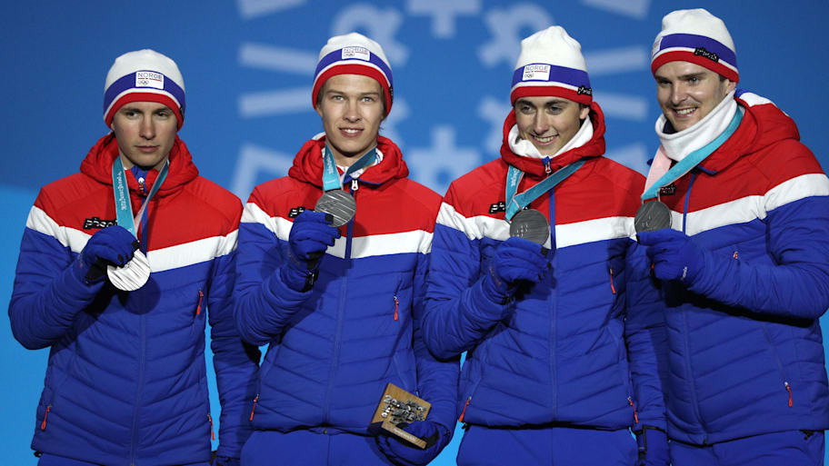 Team Norway celebrates winning the silver medal in the Nordic combined.