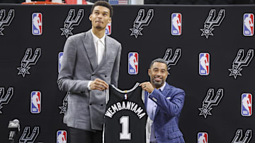 Jun 24, 2023; San Antonio, TX, USA; San Antonio Spurs draft pick Victor Wembanyama holds a jersey with general manager Brian Wright during a press conference at AT&T Center. Mandatory Credit: Troy Taormina-Imagn Images