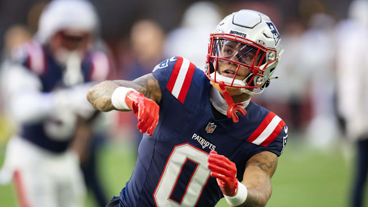 Dec 15, 2024; Glendale, Arizona, USA; New England Patriots cornerback Christian Gonzalez (0) against the Arizona Cardinals at State Farm Stadium. Mandatory Credit: Mark J. Rebilas-Imagn Images