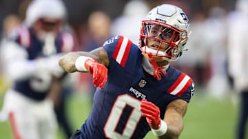 Dec 15, 2024; Glendale, Arizona, USA; New England Patriots cornerback Christian Gonzalez (0) against the Arizona Cardinals at State Farm Stadium. Mandatory Credit: Mark J. Rebilas-Imagn Images