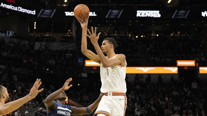 Nov 10, 2023; San Antonio, Texas, USA; San Antonio Spurs forward Victor Wembanyama (1) passes the ball over Minnesota Timberwolves guard Anthony Edwards (5) and center Rudy Gobert (27) during the first half at Frost Bank Center. Mandatory Credit: Scott Wachter-USA TODAY Sports