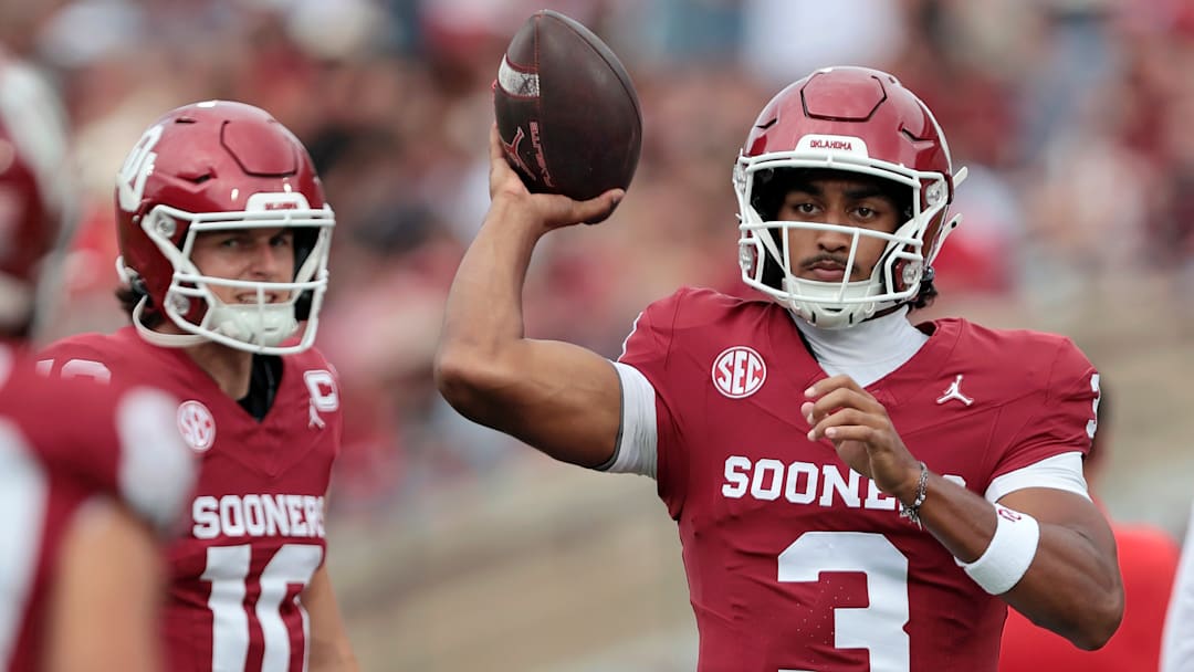 Quarterback Michael Hawkins Jr. #3 of the Oklahoma Sooners throws a pass as quarterback John Mateer #10 watches before a game against the Illinois State Redbirds at Gaylord Family Oklahoma Memorial Stadium on August 30, 2025 in Norman, Oklahoma. Oklahoma won 35-3.