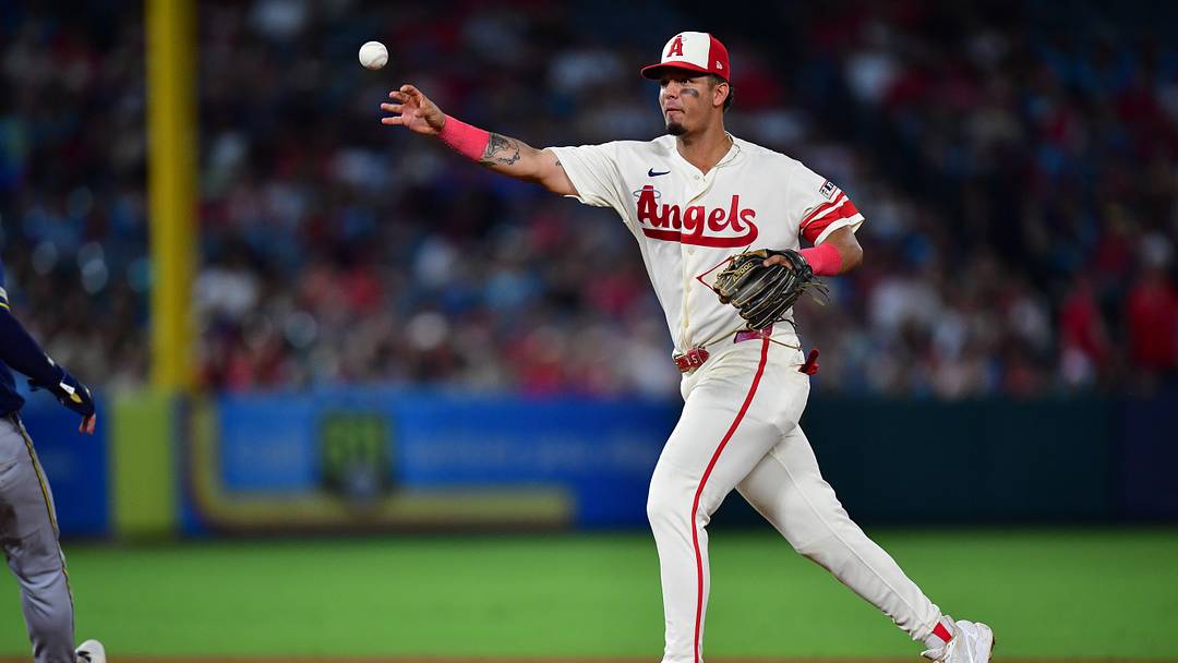 Jul 31, 2026; Anaheim, California, USA; Los Angeles Angels second baseman Vaughn Grissom (5) throws to first for the out against Milwaukee Brewers designated hitter Christian Yelich (22) during the eighth inning at Angel Stadium. Mandatory Credit: Gary A. Vasquez-Imagn Images