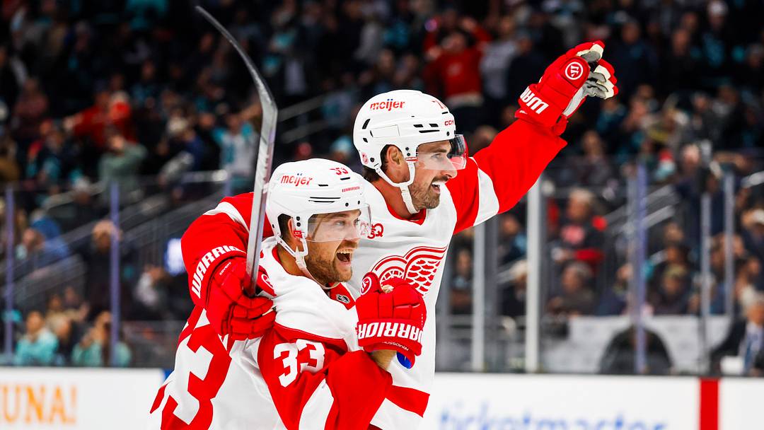 Detroit Red Wings center Dylan Larkin (71) and left wing Viktor Arvidsson (33) celebrate  Credit: Joe Nicholson-Imagn Images