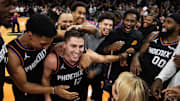 Nov 21, 2025; Phoenix, Arizona, USA; Phoenix Suns guard Collin Gillespie (12) celebrates with teammates after hitting the game winning shot against the Minnesota Timberwolves in the second half of an NBA Cup game at Mortgage Matchup Center. Mandatory Credit: Mark J. Rebilas-Imagn Images