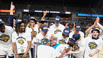 Mar 11, 2025; Indianapolis, IN, USA; The Robert Morris Colonials celebrate after defeating the Youngstown State Penguins to win the Horizon League Championship at Corteva Coliseum. Mandatory Credit: Robert Goddin-Imagn Images