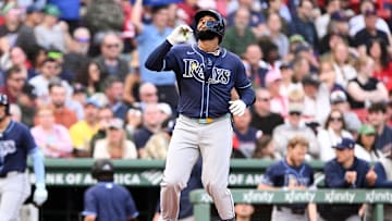 Sep 28, 2024; Boston, Massachusetts, USA; Tampa Bay Rays shortstop Junior Caminero (13) reacts after hitting a two-run home run against the Boston Red Sox during the third inning at Fenway Park.