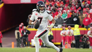 Jan 18, 2025; Kansas City, Missouri, USA; Houston Texans quarterback C.J. Stroud (7) rolls out to throw against the Kansas City Chiefs during the third quarter of a 2025 AFC divisional round game at GEHA Field at Arrowhead Stadium. Mandatory Credit: Denny Medley-Imagn Images
