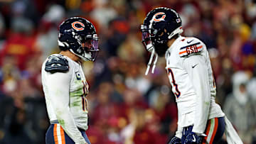Oct 27, 2024; Landover, Maryland, USA; Chicago Bears quarterback Caleb Williams (18) celebrates with wide receiver Keenan Allen (13) after the Bears scored a touchdown during the fourth quarter against the Washington Commanders at Commanders Field. Mandatory Credit: Peter Casey-Imagn Images