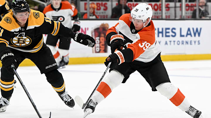 Oct 1, 2024; Boston, Massachusetts, USA; Philadelphia Flyers right wing Matvei Michkov (39) takes in shot in front of Boston Bruins center Trent Frederic (11) during the second period at the TD Garden. Mandatory Credit: Brian Fluharty-Imagn Images