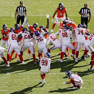 Oct 19, 2025; Denver, Colorado, USA; New York Giants kicker Jude McAtamney (99) kicks a field goal during the second half against the Denver Broncos at Empower Field at Mile High.  