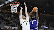 High Point Panthers forward Kimani Hamilton (5) shoots the ball against Purdue Boilermakers forward Caleb Furst (1) during the first half at Amica Mutual Pavilion. 