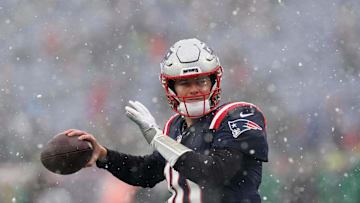 Jan 7, 2024; Foxborough, Massachusetts, USA; New England Patriots quarterback Mac Jones (10) warms up before the start of the game against the New York Jets at Gillette Stadium. Mandatory Credit: David Butler II-Imagn Images