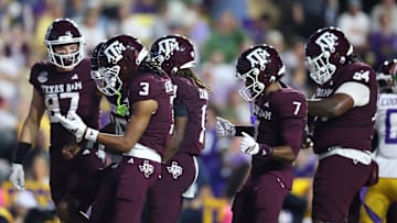 Oct 25, 2025; Baton Rouge, Louisiana, USA; Texas A&M Aggies quarterback Marcel Reed (10) celebrates with teammates after a touchdown during the first half against the Louisiana State Tigers at Tiger Stadium. Mandatory Credit: Stephen Lew-Imagn Images