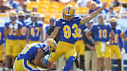 Aug 30, 2025; Pittsburgh, Pennsylvania, USA; Pittsburgh Panthers place kicker Trey Butkowski (93) kicks a field goal from the hold of punter Caleb Junko (91) against the Duquesne Dukes during the fourth quarter at Acrisure Stadium. Mandatory Credit: Charles LeClaire-Imagn Images