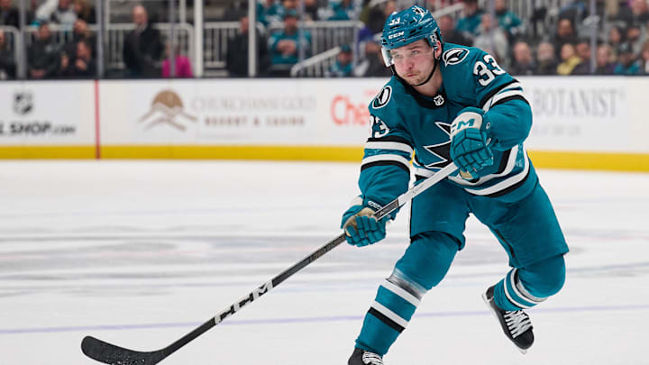 Apr 4, 2024; San Jose, California, USA; San Jose Sharks defenseman Calen Addison (33) passes the puck against the Los Angeles Kings during the second period at SAP Center at San Jose. Mandatory Credit: Robert Edwards-Imagn Images