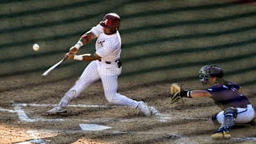 May 11 2024; Tuscaloosa, AL, USA; Alabama hitter Ian Petrutz (21) connects with a pitch against LSU at Sewell-Thomas Stadium Saturday. Alabama lost 6-3 as LSU evened the weekend series.