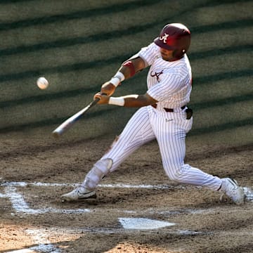 May 11 2024; Tuscaloosa, AL, USA; Alabama hitter Ian Petrutz (21) connects with a pitch against LSU at Sewell-Thomas Stadium Saturday. Alabama lost 6-3 as LSU evened the weekend series.