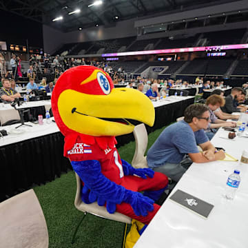 Jul 8, 2025; Frisco, TX, USA; Big Jay the Kansas Jayhawks mascot listens to Big 12 Commissioner Brett Yormark address the media during the 2025 Big 12 Football Media Days at The Star. Mandatory Credit: Raymond Carlin III-Imagn Images