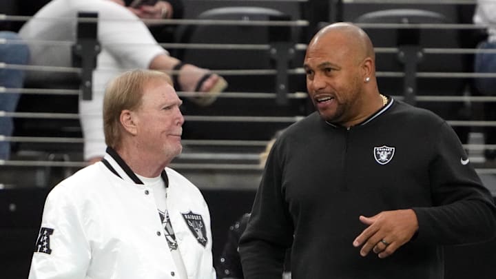 Mark Davis and Antonio Pierce talk before a Raiders game. Mark Davis and Antonio Pierce talk before a Raiders game.