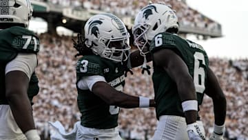 Aug 29, 2025; East Lansing, Michigan, USA; Michigan State Spartans wide receiver Nick Marsh (6) and tight end Michael Masunas (81) celebrate a touchdown during the second quarter at Spartan Stadium. Mandatory Credit: Brendan Mullin-Imagn Images