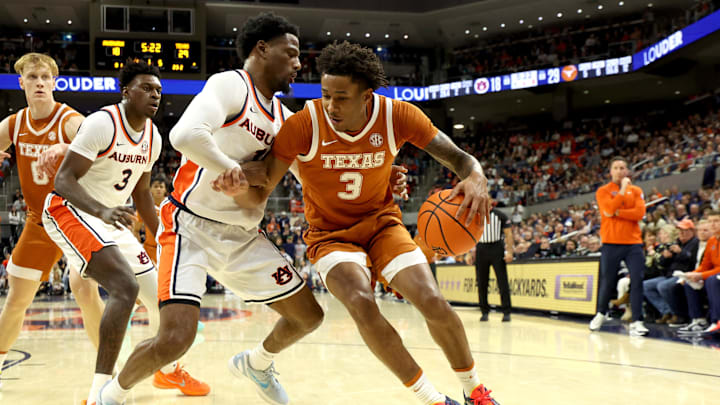 Jan 28, 2026; Auburn, Alabama, USA;  Texas Longhorns forward Dailyn Swain (3) is pressured by Auburn Tigers guard Kevin Overton (1) during the first half at Neville Arena. Mandatory Credit: John Reed-Imagn Images