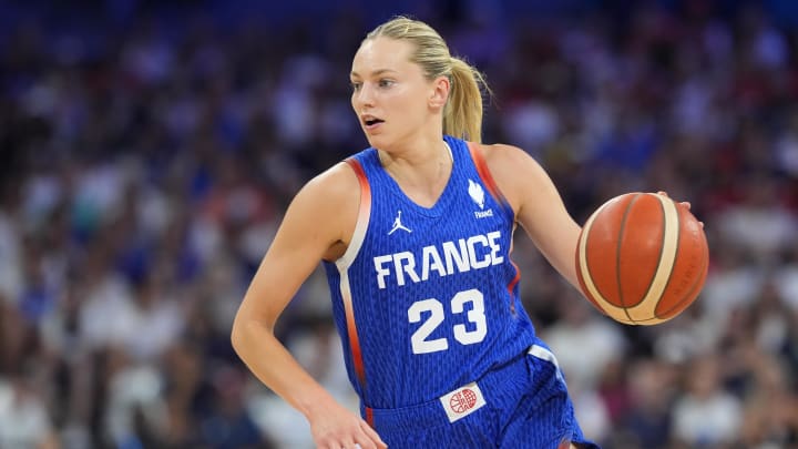 Jul 29, 2024; Villeneuve-d'Ascq, France; France guard Marine Johannes (23) dribbles the ball during the second quarter against Canada during the Paris 2024 Olympic Summer Games at Stade Pierre-Mauroy. Mandatory Credit: John David Mercer-USA TODAY Sports