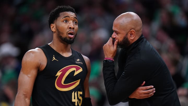 May 9, 2024; Boston, Massachusetts, USA; Cleveland Cavaliers head coach J. B. Bickerstaff talks with guard Donovan Mitchell (45) from the sideline as they take on the Boston Celtics during game two of the second round for the 2024 NBA playoffs at TD Garden. Mandatory Credit: David Butler II-USA TODAY Sports